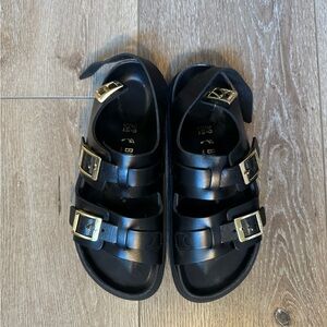 Birkenstock Black Cannes High Shine Sandals with Gold Buckles